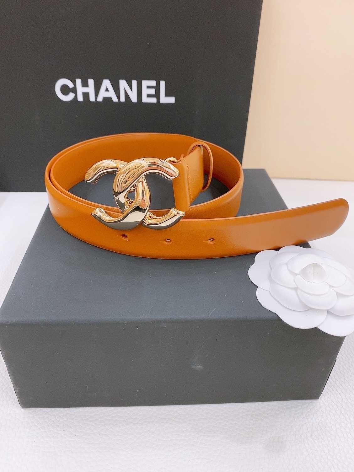 Bagsaaa Ch**el brown leather belt with a gold-tone interlocking CC logo buckle
